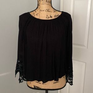 Steezeyer black gauze top with beautiful cotton lace sleeve cuffs.  Size small.